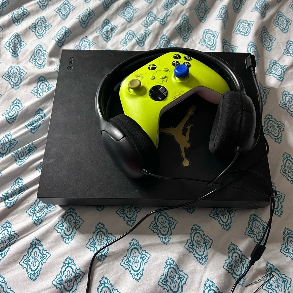 Sony Black Console with Green Controller and Black Headset